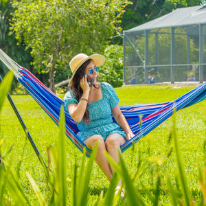 Woman on phone sitting in bliss hammock