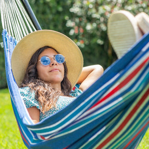 woman and dog relaxing in bliss hammock