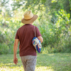 man carrying bag using included carrying bag