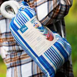 Close-up of the carrying bag being held from a person's shoulder.
