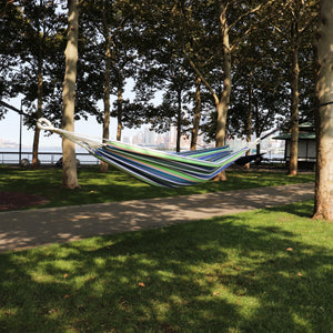 40-inch garden stripe hammock hung outside between two trees.