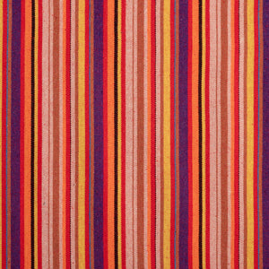 Close-up of the fabric and pattern showing the thin red, orange, yellow, purple, black, and beige stripes.