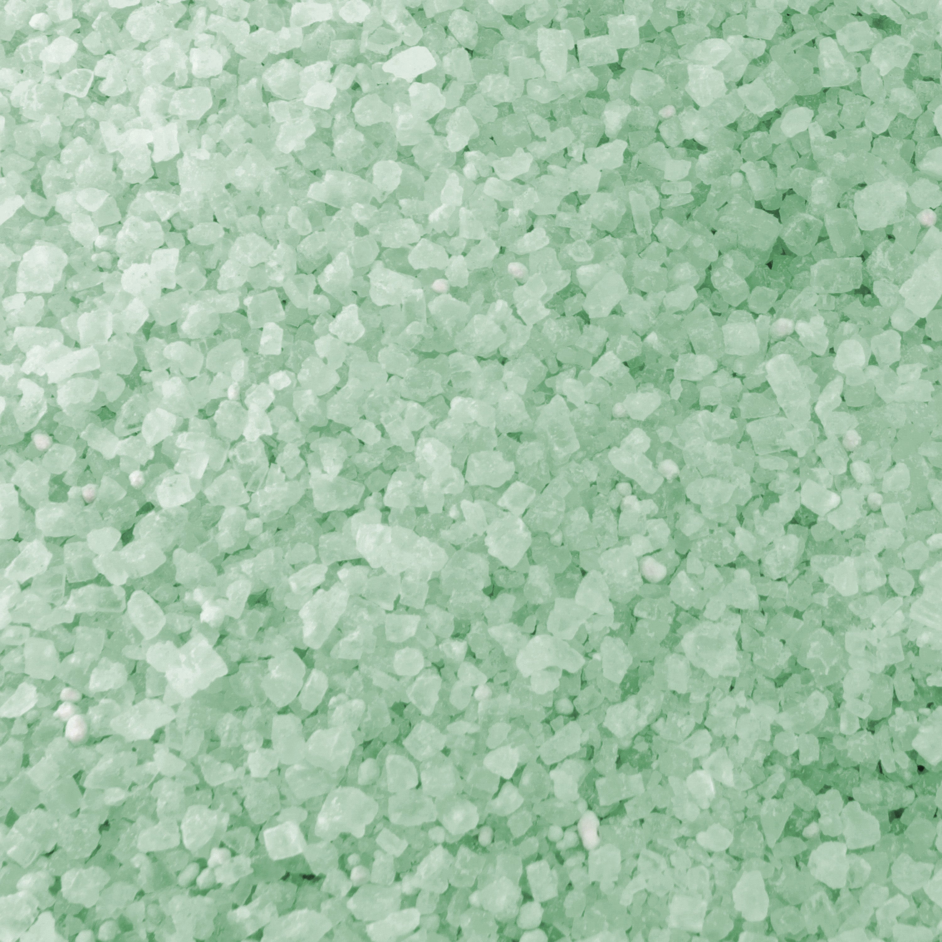 Close-up of the green colored Keep It Green Ice Melt.