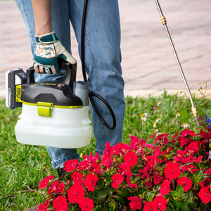 Person using the Sun Joe 24-volt cordless Multi-Purpose Chemical Sprayer Kit to spray flowers.