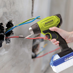 Person using the Sun Joe 24-volt cordless Heat Gun to assist with electrical work.