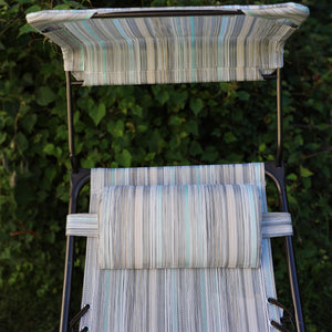 Close-up of the headrest and canopy on the 26-inch casual stripe gravity free chair.