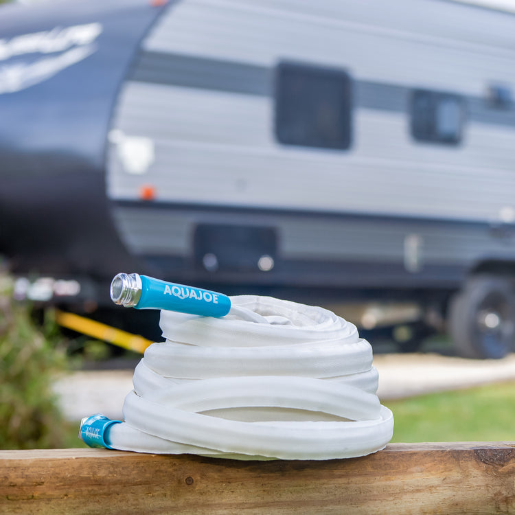 Aqua Joe 50-foot Fiberjacket RV hose with an RV in the background.