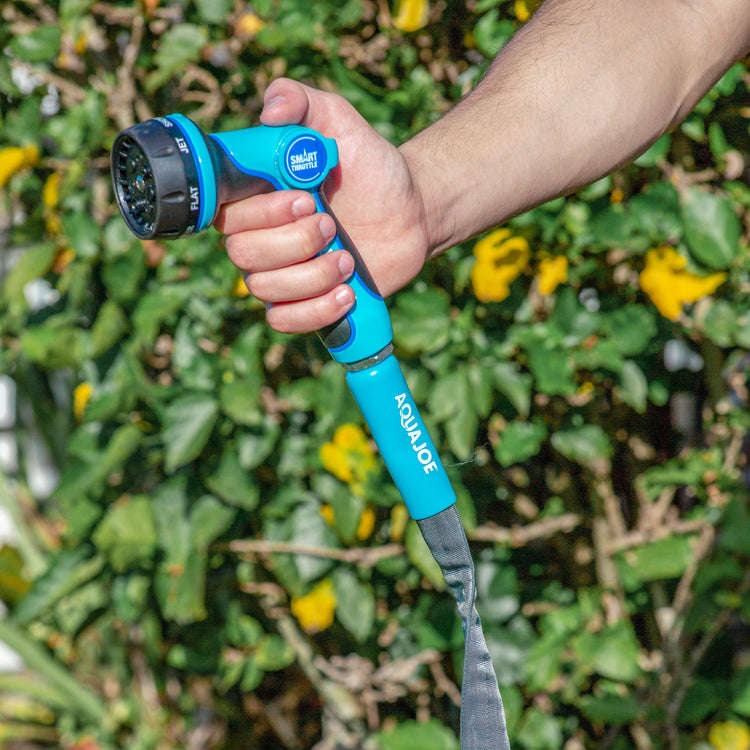 Aqua Joe FiberJacket Garden Hose connected to a hose nozzle.