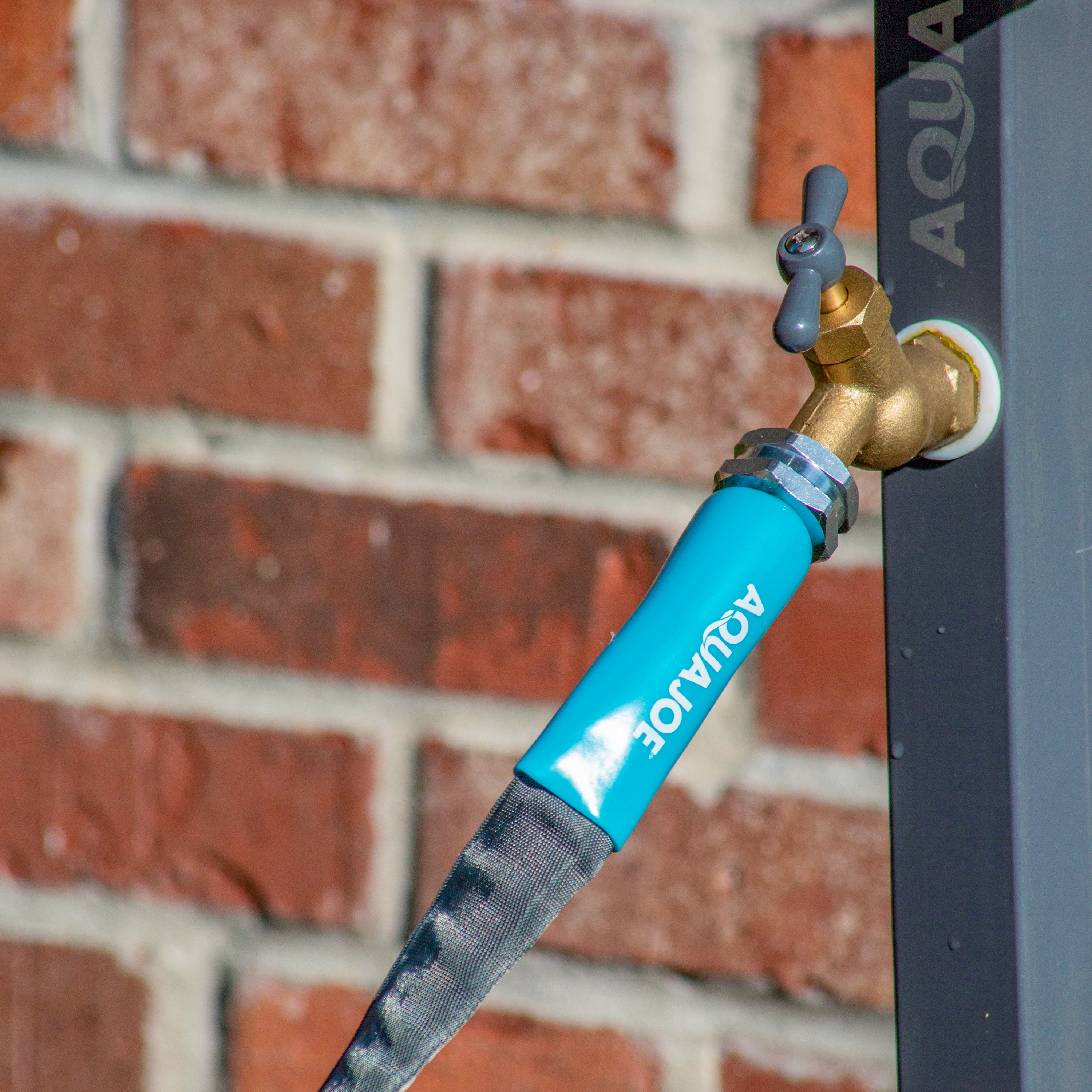 Aqua Joe FiberJacket Garden Hose connect to a faucet.