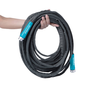 Person holding the Aqua Joe 75-foot fiberjacket garden hose.