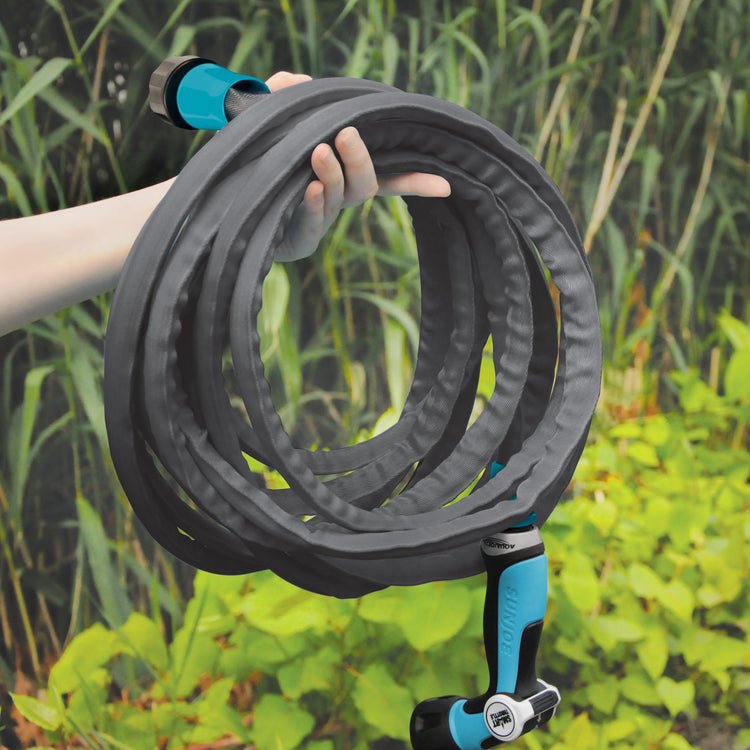 Person holding a raveled Aqua Joe Ultra Flexible Kink Free FiberJacket Garden Hose.