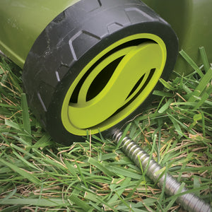 Lawn Mower driving over the Aqua Joe Heavy-Duty Puncture Proof Kink-Free Metal Garden Hose.