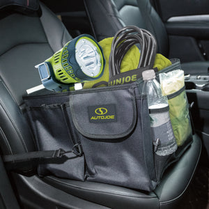 Auto Joe Collapsible Auto Storage Organizer sitting in a car seat filled with a flashlight, power cord, water bottle, and more.