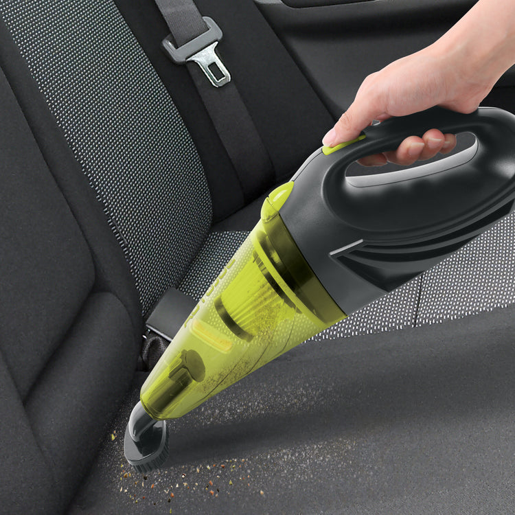 Auto Joe 12-Volt Portable Car Vacuum Cleaner with the brush attachment being used to clean the backseat of a car.