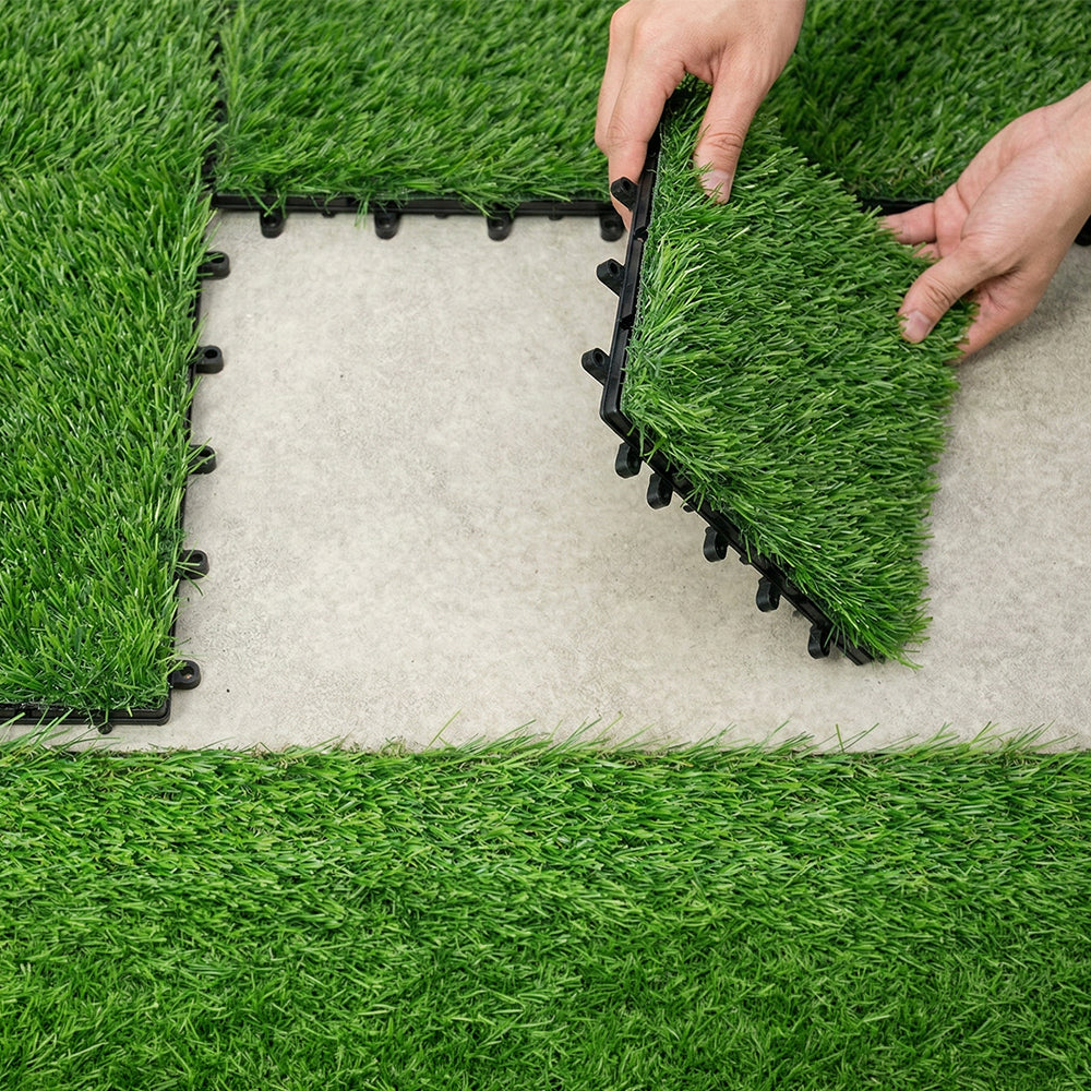 Green artificial grass interlocking tiles installed in a finished space
