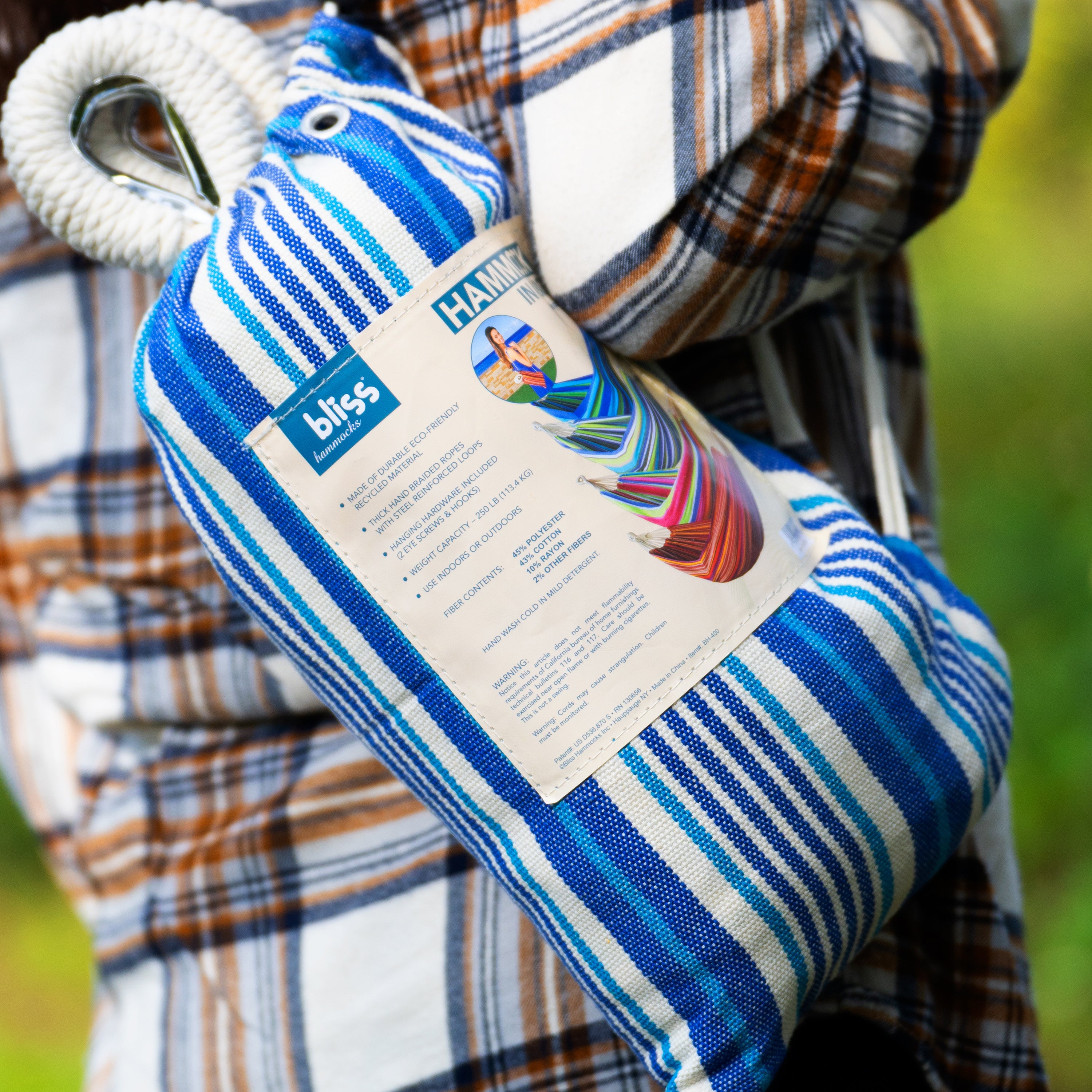 Close-up of the carrying bag being held from a person's shoulder.