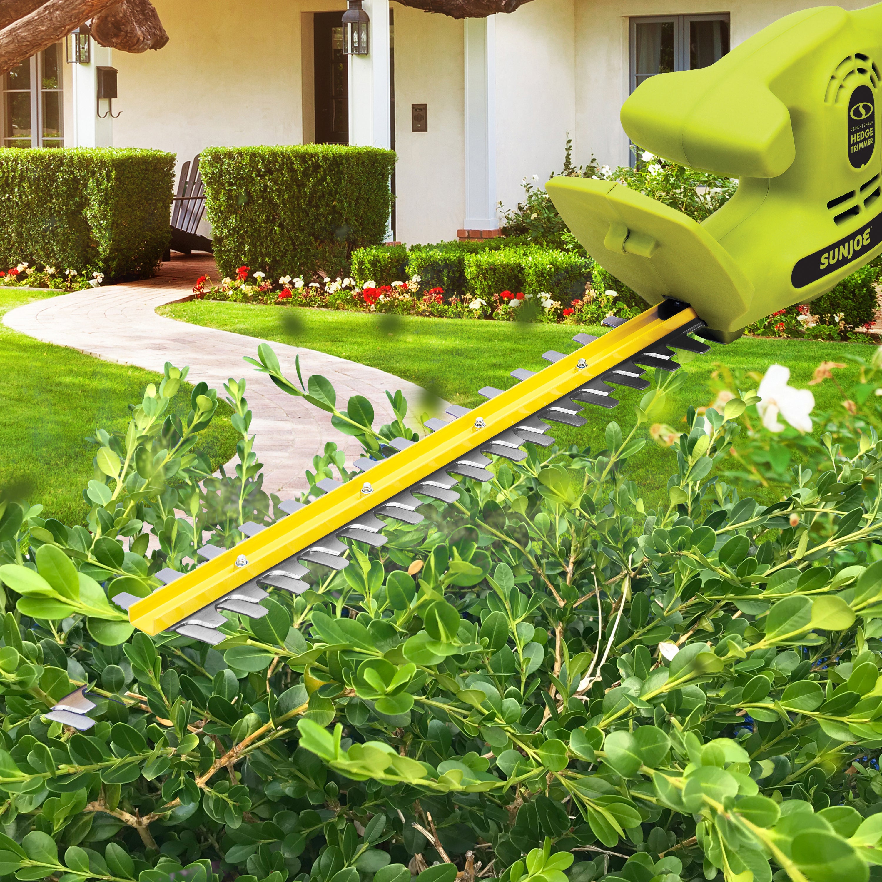 Sun Joe 3.8-amp 22-inch Electric Hedge Trimmer cutting a bush.