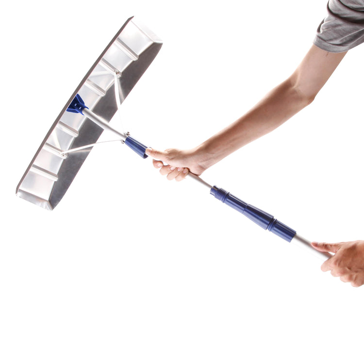 Person holding the Snow Joe 21-foot aluminum telescoping snow shovel roof rake.