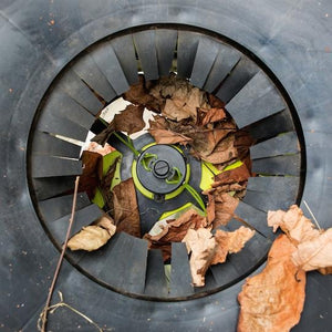 Close-up of leaves being shredded in the Sun Joe 13-amp Electric Leaf Mulcher and Shredder.