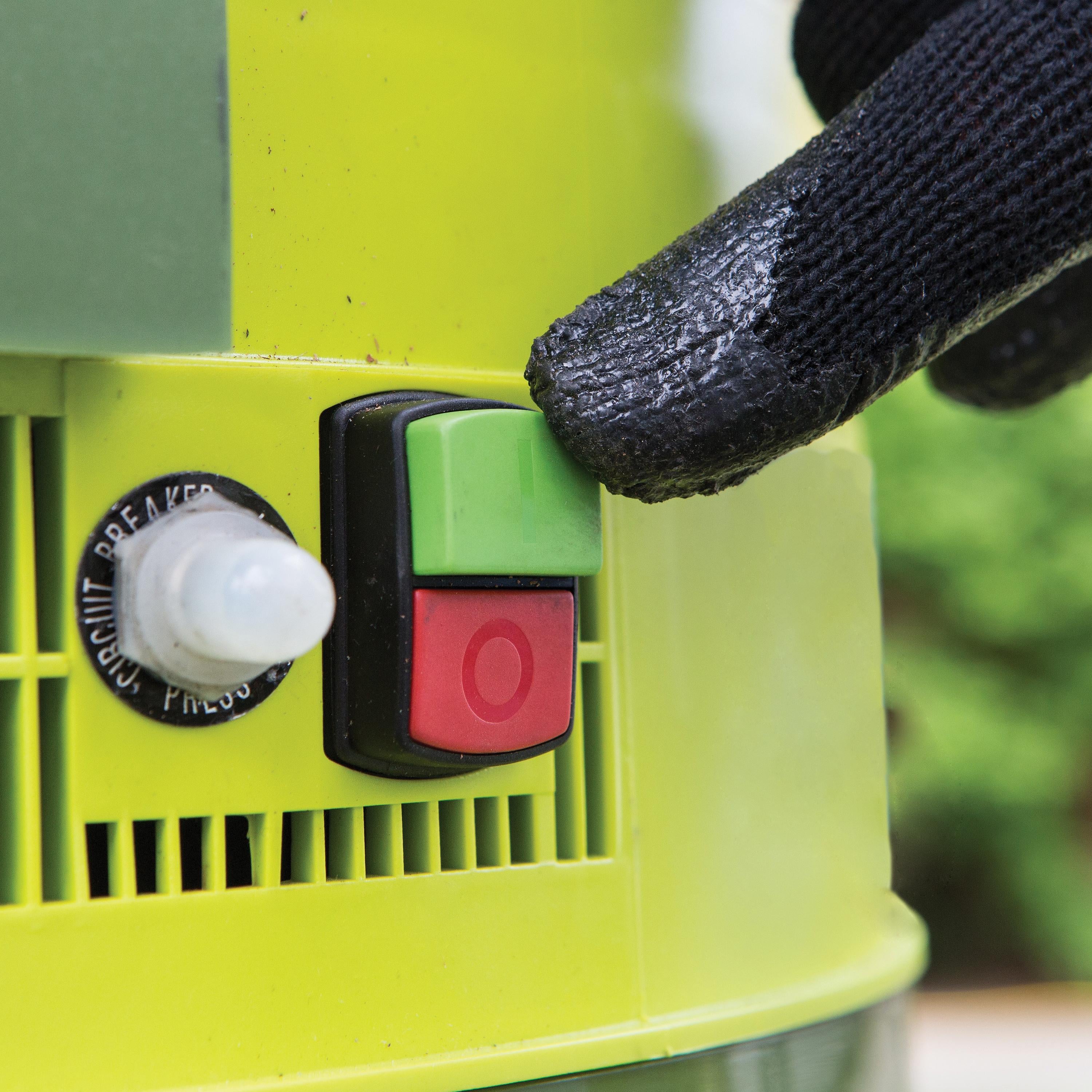 Close-up of the on and off buttons on the Sun Joe 13-amp Electric Leaf Mulcher and Shredder.