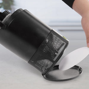 Person placing a new sticky trap into the tray on the bottom of the Sun Joe black non-toxic UV Indoor Insect Trap