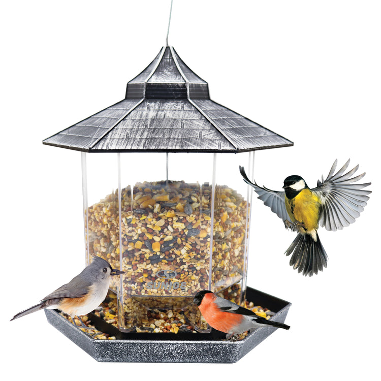 Sun Joe silver hexagonal Wild Bird Hanging Feeder filled with food and birds around it.