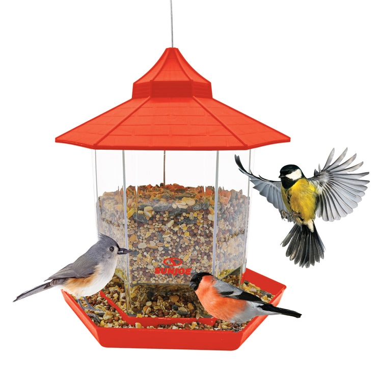 Sun Joe red hexagonal Wild Bird Hanging Feeder filled with food and birds around it.