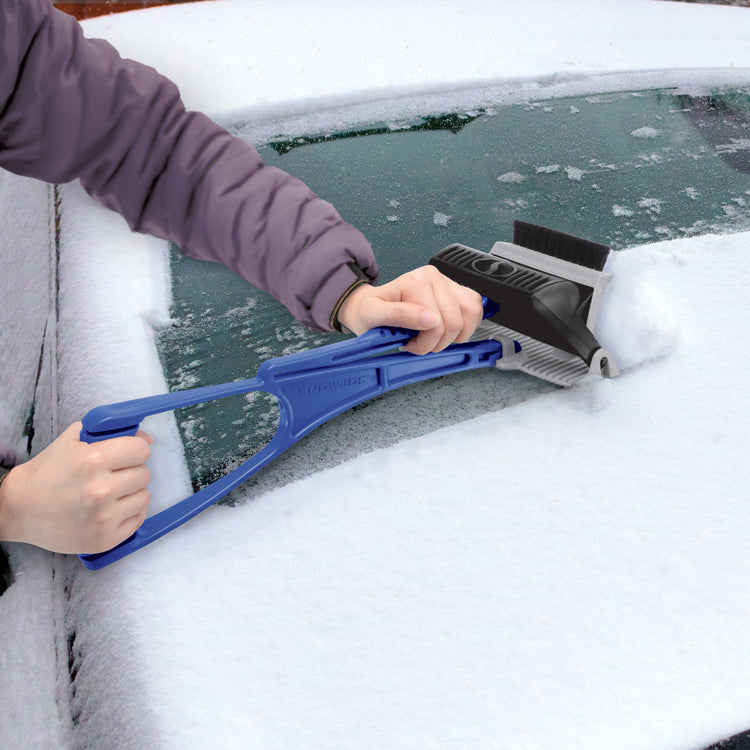 Snow Joe Ice Dozer Ice and Snow Scraper being used to push snow off a car windshield.