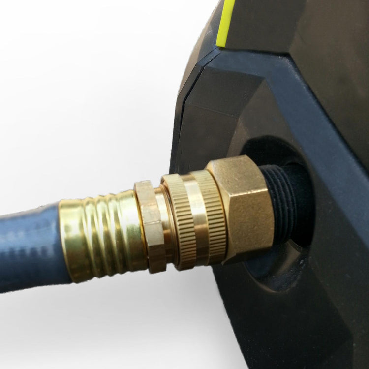 Sun Joe Universal Dual Swivel Brass Double Female Connector for pressure washers connected to a pressure wash and garden hose.