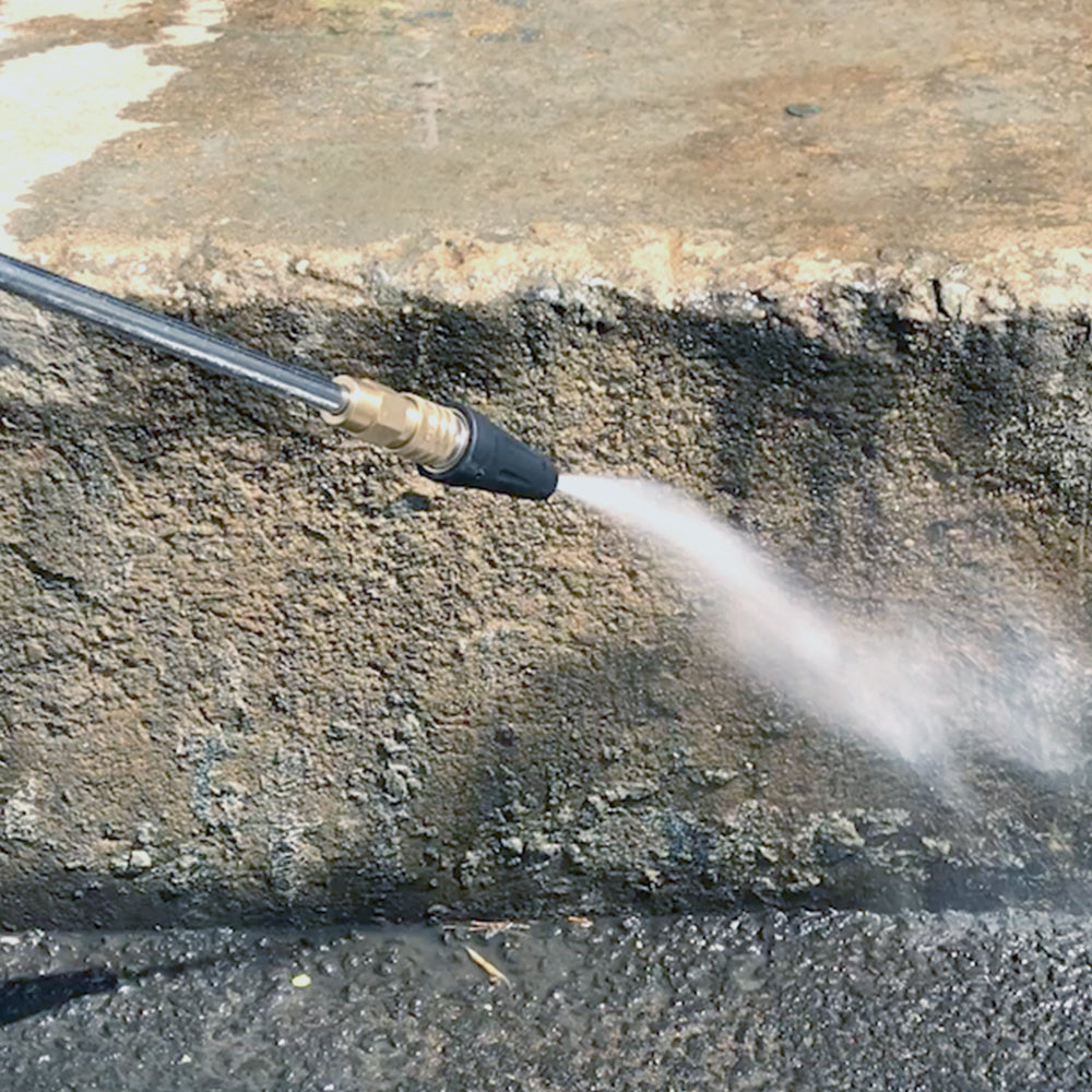 Sun Joe Universal Turbo Head Spray Nozzle for pressure washers being used to clean concrete