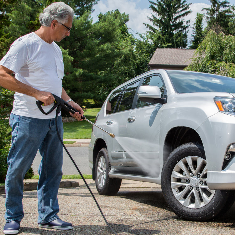 man using spx3000 max to clean car rims