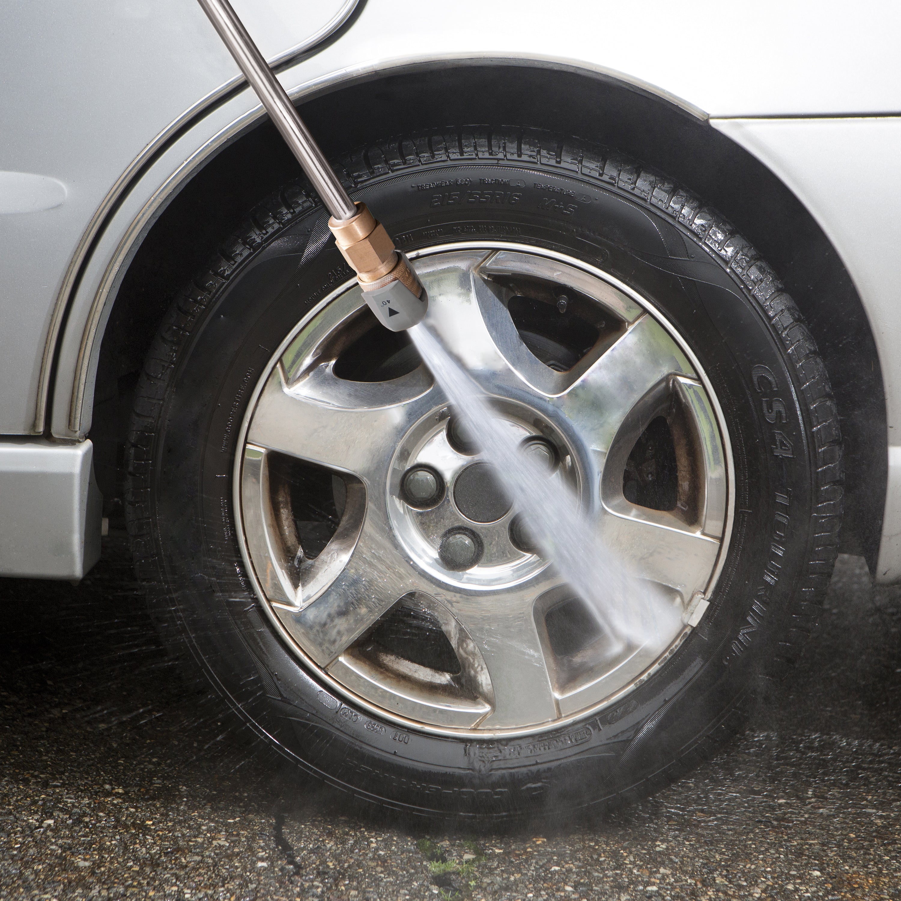 fourty degree nozzle being used to clean car wheel