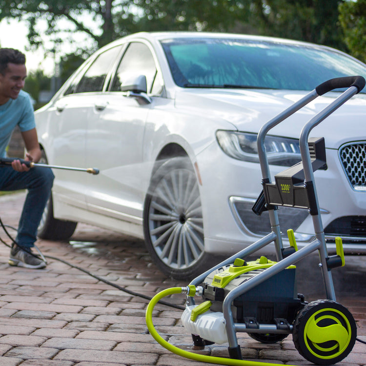 SPX4004-MAX electric pressure washer being used to wash rim of car