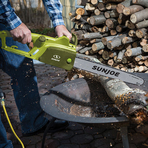 Sun Joe 14-amp 16-inch Electric Chain Saw cutting through a log.