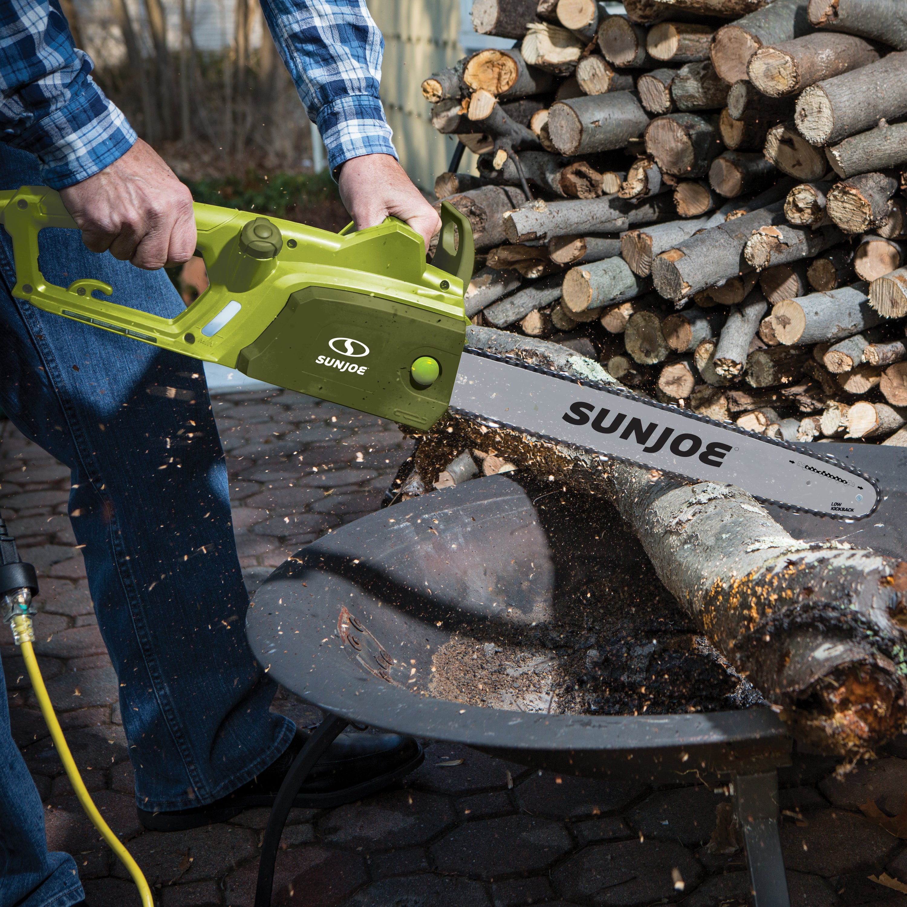 Sun Joe 14-amp 18-inch Electric Chain Saw cutting through a log.